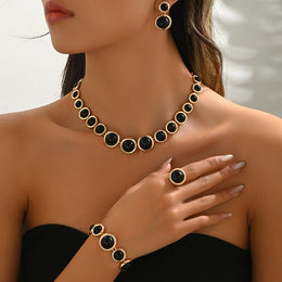 Alternate front view of the black circular-detail jewellery set
