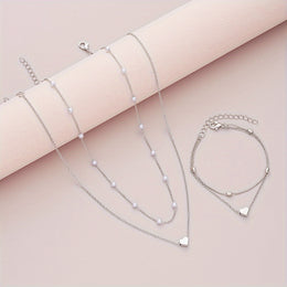 Variant-linked silver-tone layered set laid flat