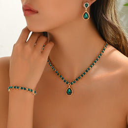 Closer worn view of the green oval-detail four-piece jewellery set