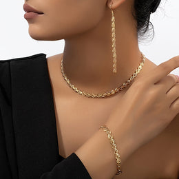 Alternate worn view of the gold-tone leaf-link three-piece jewellery set