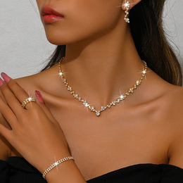 Variant-linked gold-tone four-piece set worn together