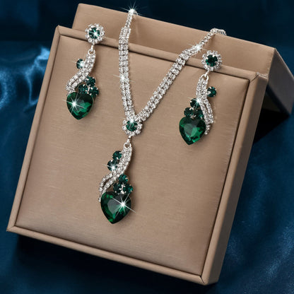 Green-detail necklace and earrings in a presentation box