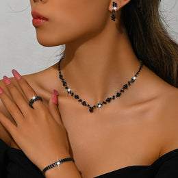 Variant-linked black four-piece set worn together