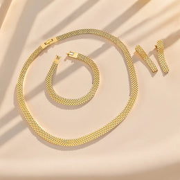 Alternate flat lay of the gold-tone mesh jewellery set