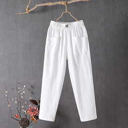 White Teresa straight-leg trousers with elastic waist and patch pockets, front view